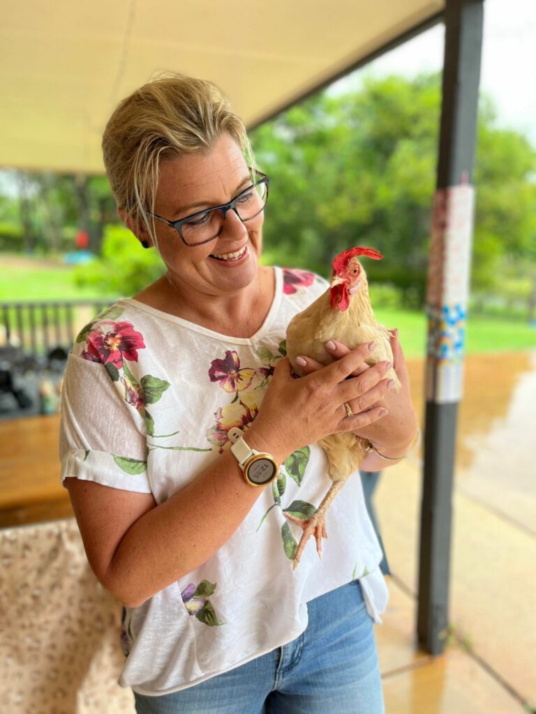 Celebrant Anna Staines with chicken ringbearer Pepper
